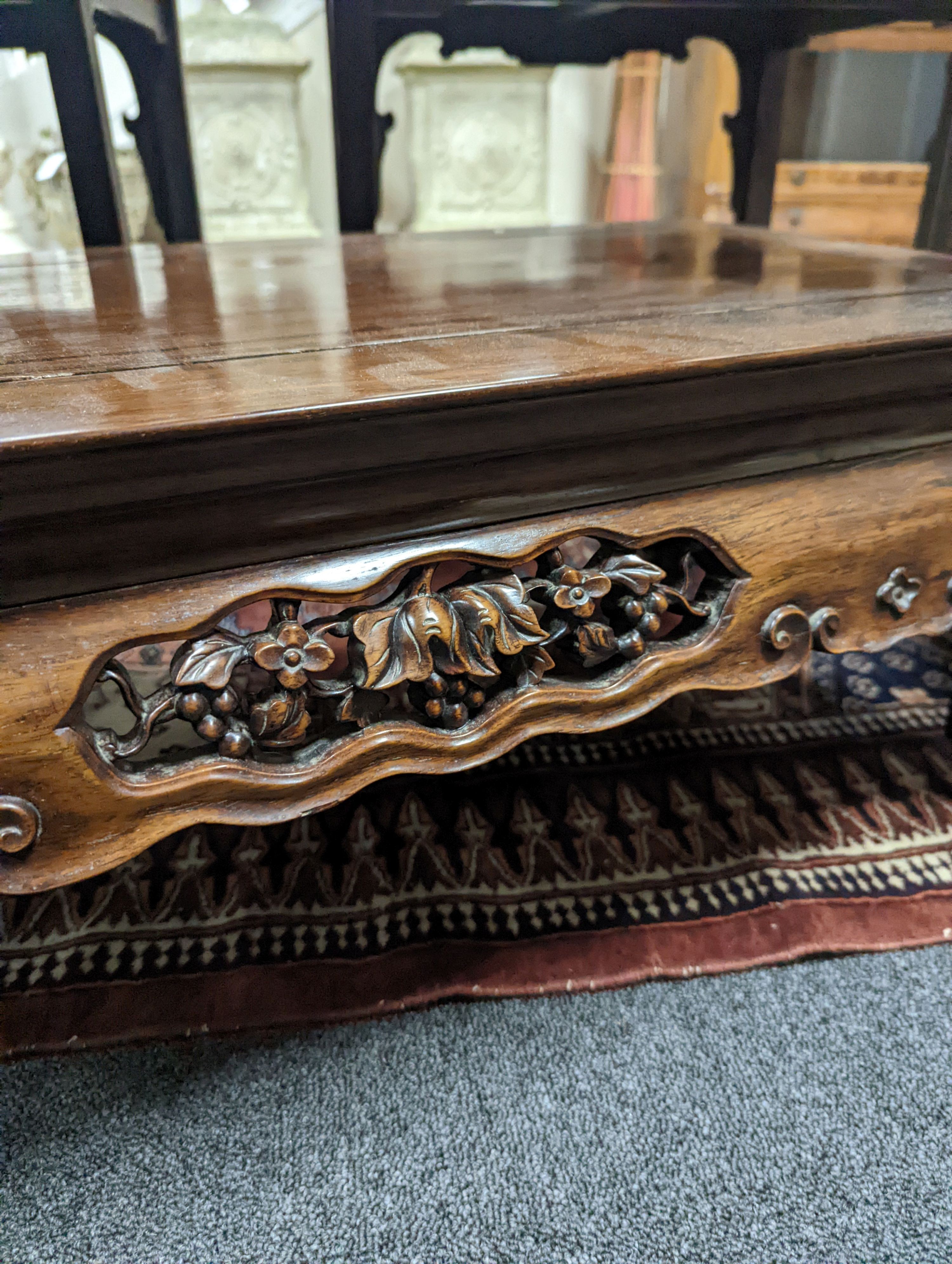 A Chinese hongmu Kang table, 19th century, 79 cm long, 43 cm wide, 27 cm high, old repairs